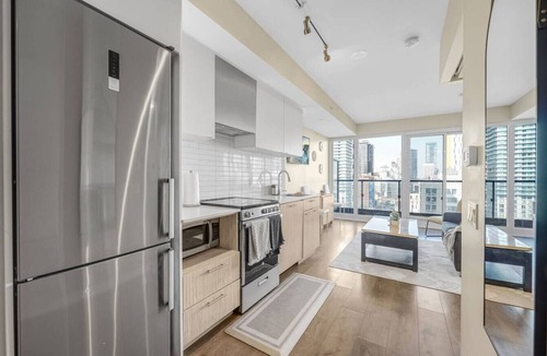 Garden District Apartment | Suite Mia: Medical District 2BR Walk to St. Mike’s