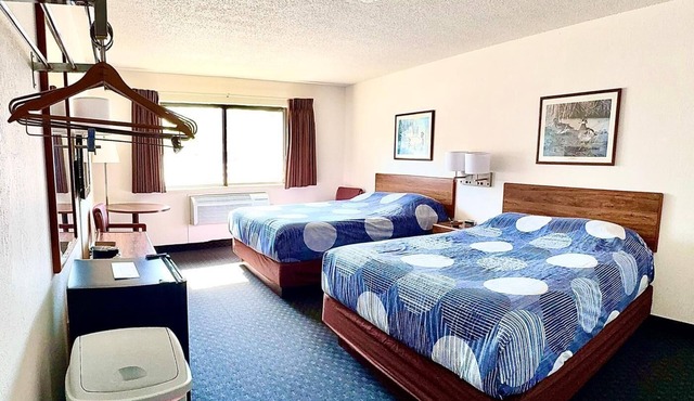 Accessible ADA room with two queen beds, private bathroom, mini fridge, and single-serve coffee maker. in Boulder Junction