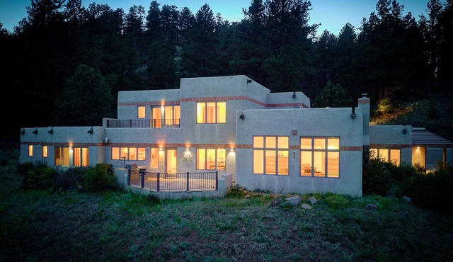 Amazing mountain home on 126 acres bordering national forest land in Woodland Park