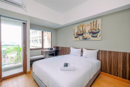 Comfortable Pool View Studio Room at Gateway Park LRT City Jatibening Apartment By Travelio in Bekasi