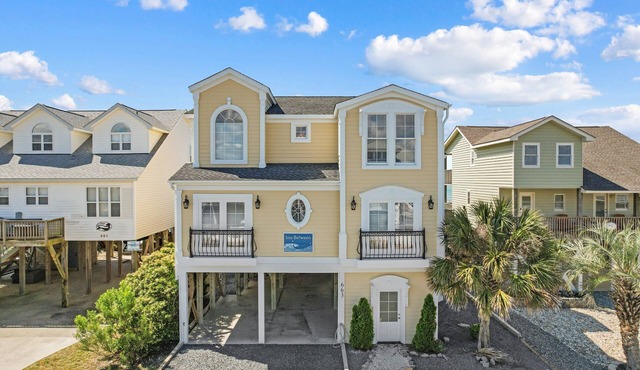Experience oceanfront bliss at Inn Between, a spacious 6-bedroom getaway in Holden Beach. in Holden Beach