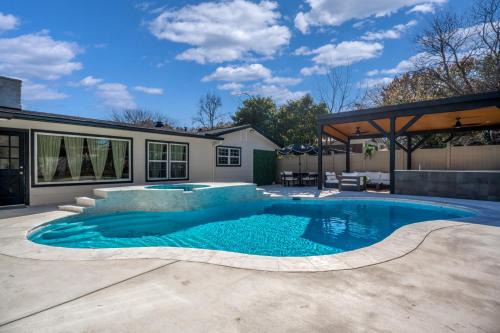 Relaxed Luxury Pet Friendly Home with Pool and Backyard Lounge in San Antonio, TX