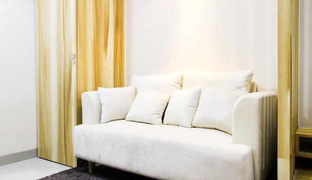Modern Style The Oasis Studio Apartment with Comfortable Sofa in Cikarang